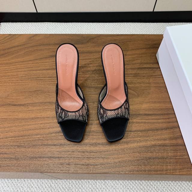 Amina Muaddi lace and mesh slippers. The lace fabric is delicate and soft, evoki