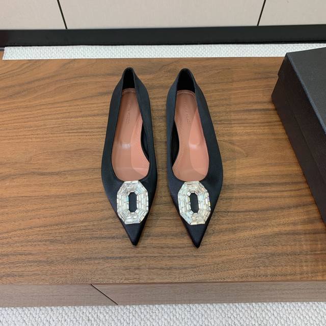 Amina Muaddi diamond-buckle flats. A simple, elegant style. Patent leather and s