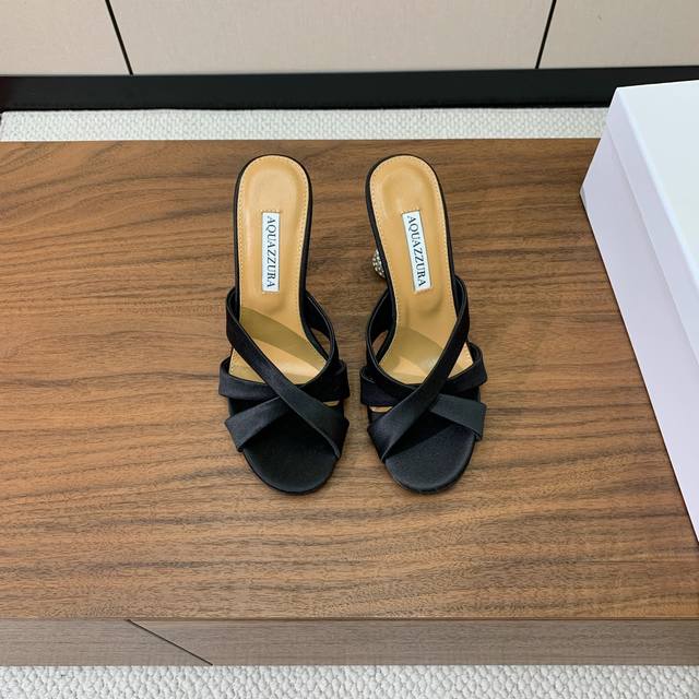 Aquazzur* diamond-heeled cross-strap slippers. A sexy brand endorsement. Upper m