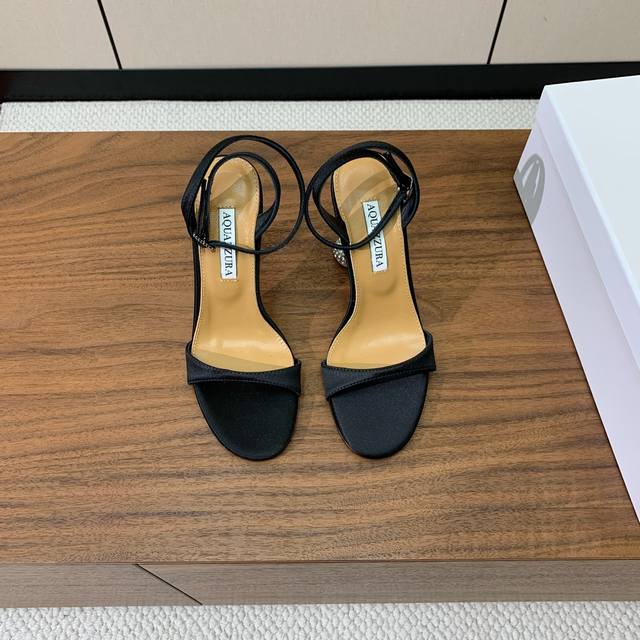 Aquazzur* diamond-heeled, one-strap sandals. A sexy brand endorsement. Upper mad