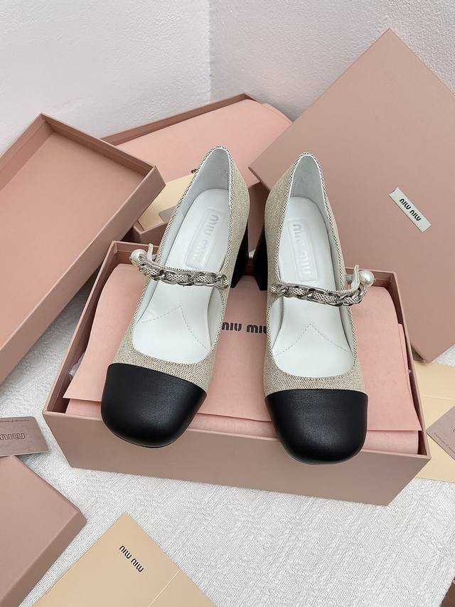 A must-have Miu*Miu classic Mary Jane sandals with square toe and chunky heel, e