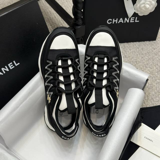 Shopping-level Chanel's newest thick-soled sneakers in the classic black and whi
