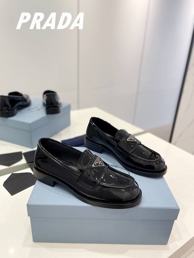 Factory Price Premium Edition Prada features a gold and silver triangle logo, fo
