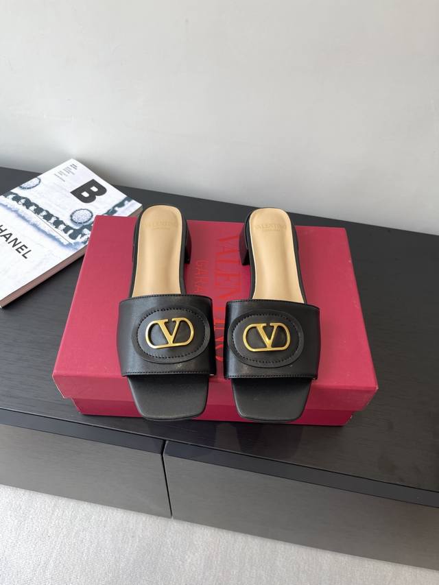 Valentino 25Ss new slippers feature a V-buckle design, a perfect departure from