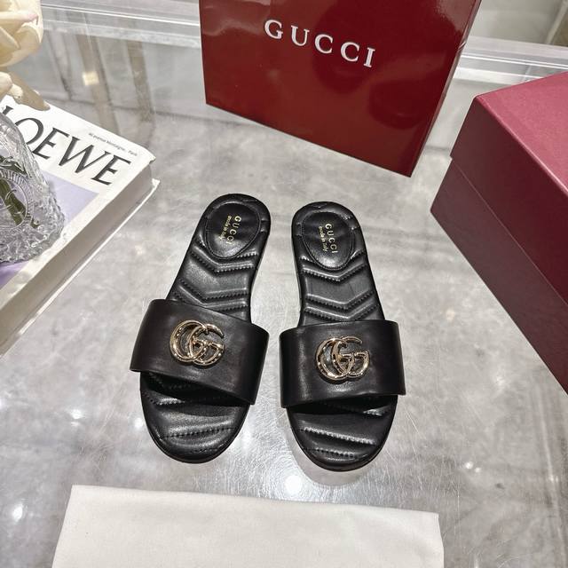 Gucci Doube G women's beach slide sandals, defined by pale gold horse head detai