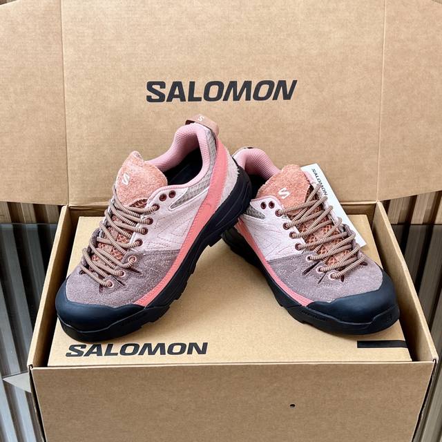 Top-of-the-line couple's pair of Salomon's X-Alp Suede retro outdoor sneakers. P