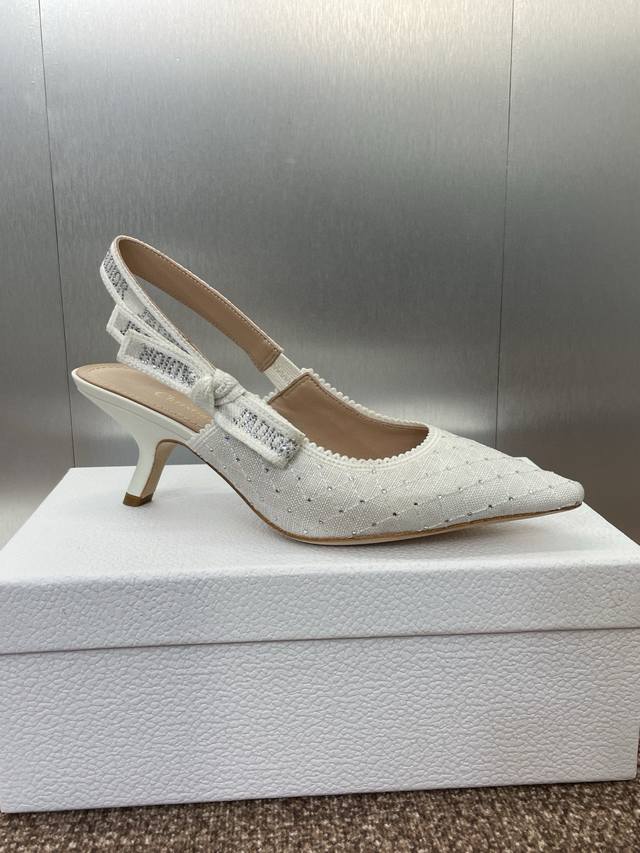 6.5cm J'adior Webbed Sandals, a top-tier, premium-priced pair from the Dior Spri