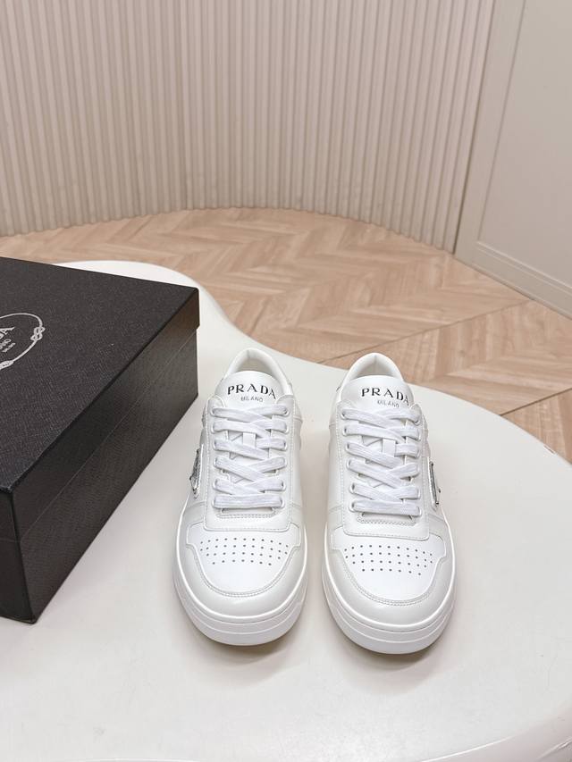 An updated version and new colorway for couples, this classic Prada white sneake