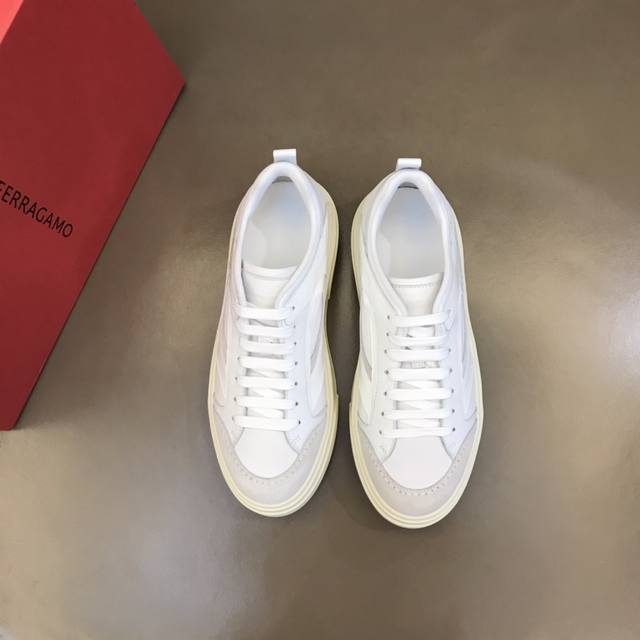 Ferragam*'s new men's patchwork sneakers feature a calfskin and fabric upper, a