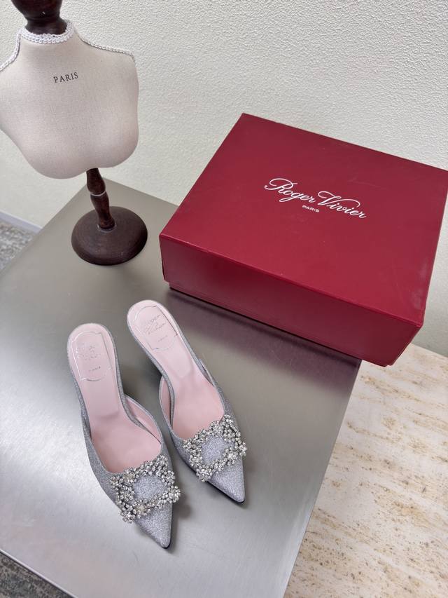 classic pointed-toe slippers with square diamond buckles. Classic, high-quality