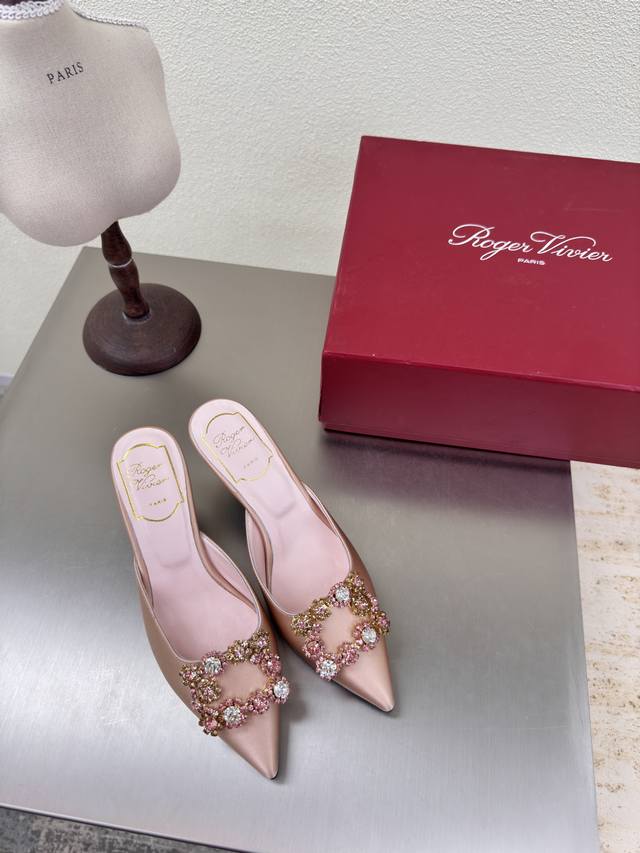 classic pointed-toe slippers with square diamond buckles. Made of classic, high-