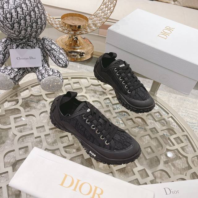 Dior monogrammed lace-up sneakers with low-tops and high tops. These sneakers ar