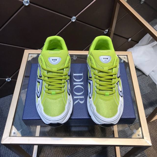 D's new low-top sneaker is crafted from gray mesh and white technical fabric, ac