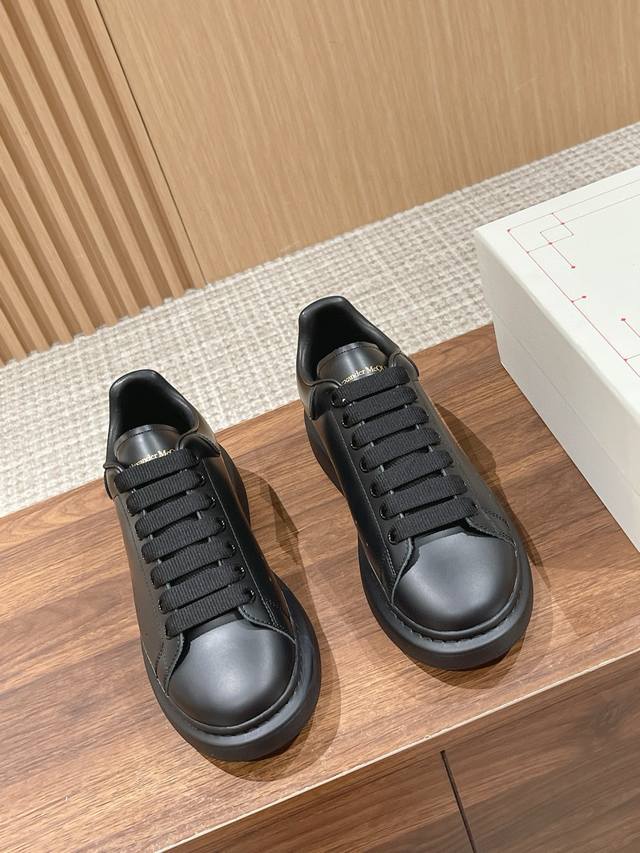 Factory Price: McQueen's classic, versatile white sneakers, featuring stain-res