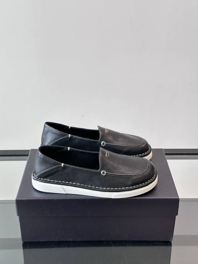Prad*'s newest men's driving shoe, a step-on casual shoe. Made from imported cow