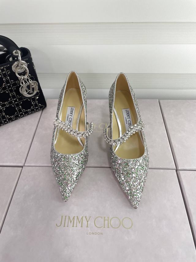 Jimmy Choo's classic diamond-strap Mary Janes (DDD) are the perfect complement