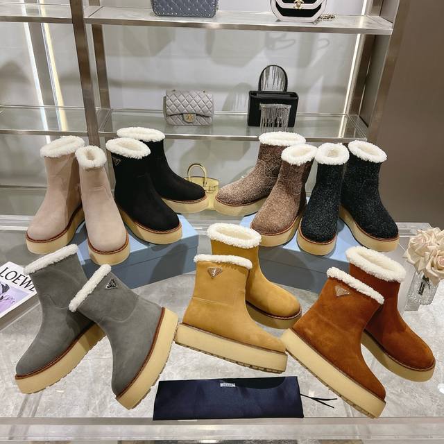 The latest Prada design, this suede cowhide ankle boot combines a thick rubber