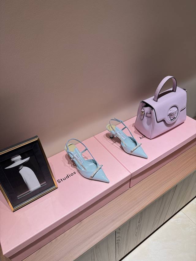 Jimmy Choo classic stretch-back pumps. The shoe's shape is incredibly refined, n