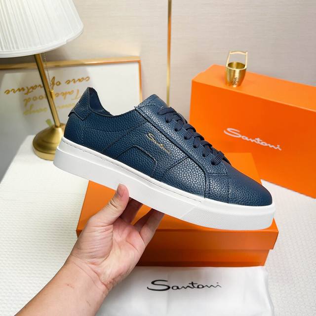 Santoni This is a men's low-top sneaker made in Italy. Material and Construction