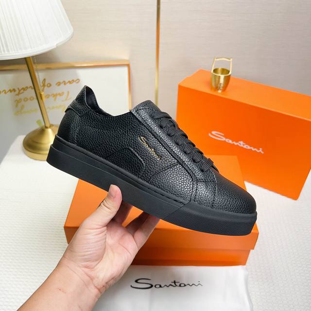 Santoni This is a men's low-top sneaker made in Italy. Material and construction