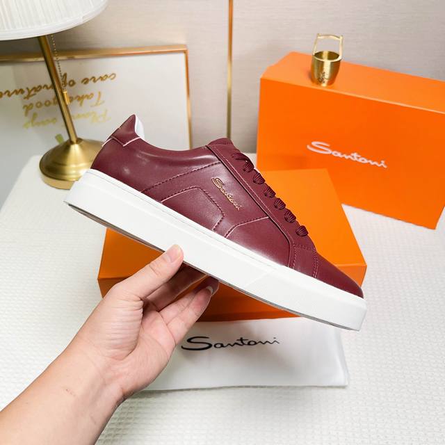 Santoni This is a low-top sports shoe with a unique design and distinctive styl