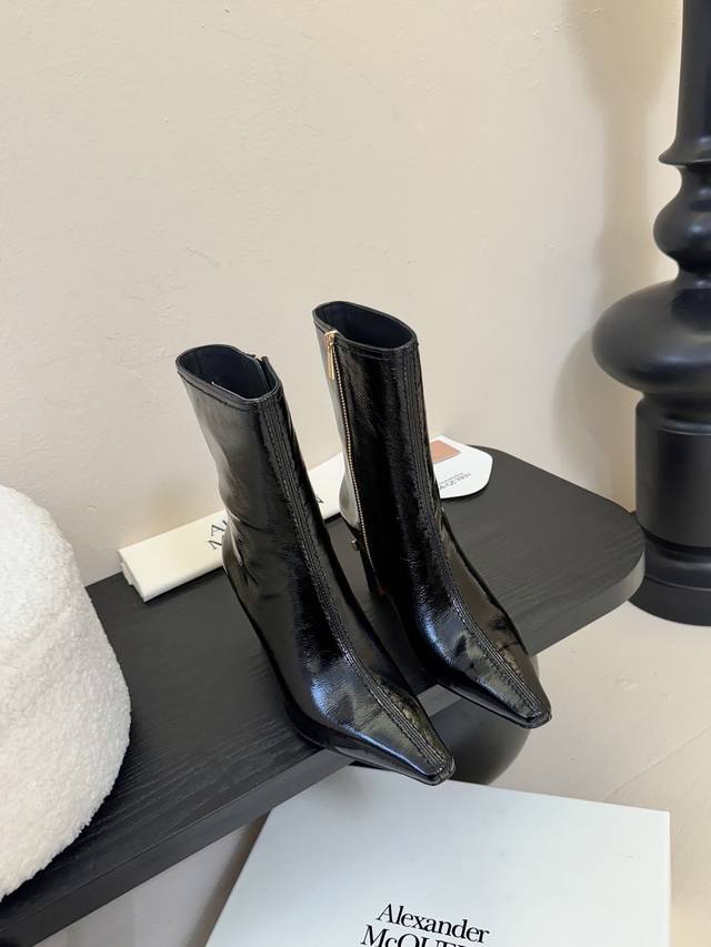 McQueen's new 25Ss minimalist leather ankle boots. These minimalist, ultra-soft,