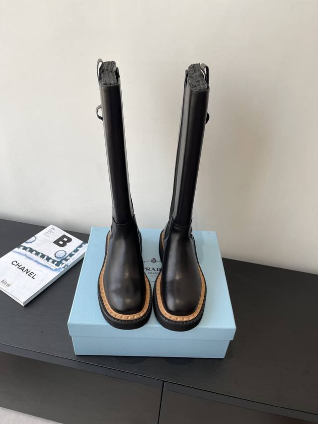 Prada's motorcycle-inspired boots are perfect for slimming down your legs. They'