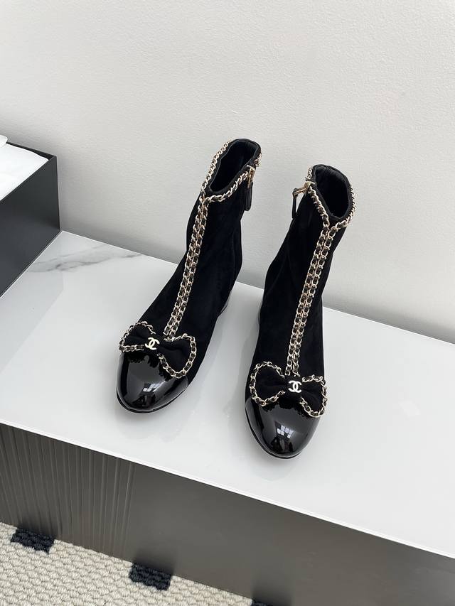 Chanel 25P Chain Bow Chunky Heel Ankle Boots This season's hottest style, featu