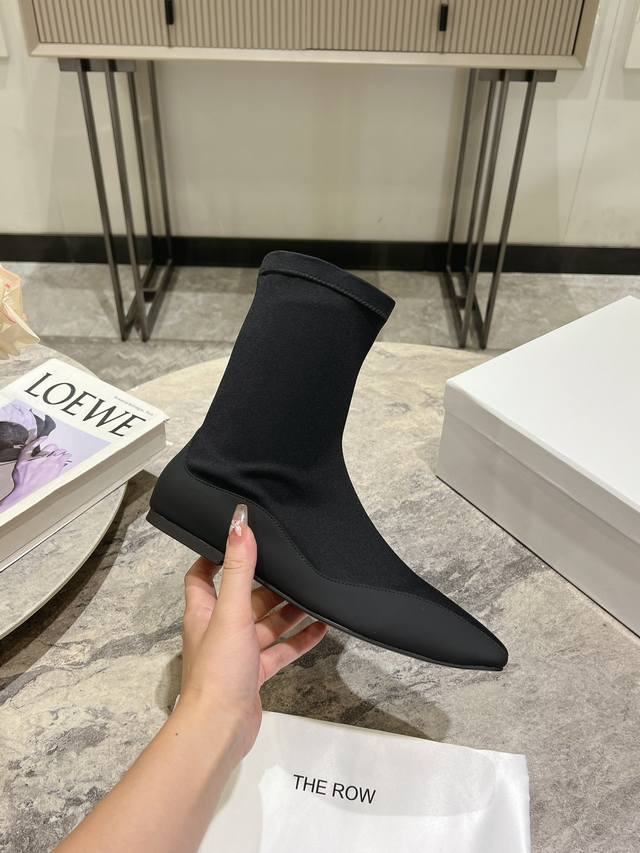 Top-quality, new niche French stretch over-the-knee boots from The Row. This sea