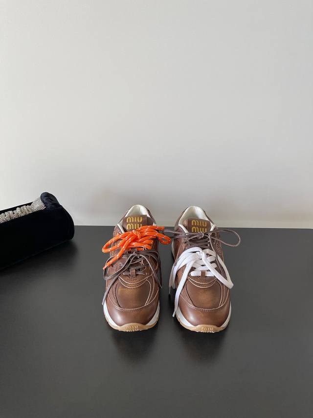 Miumiu's latest distressed thick-soled casual sneakers DDD. Miu accessories are