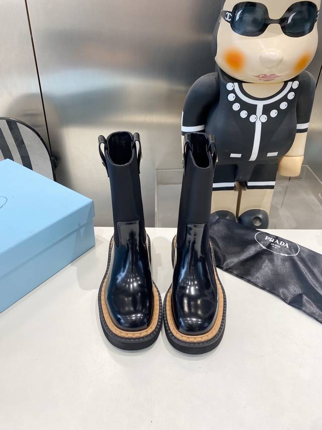 Factory-made Prada classic triangle-label slip-on boots for women. This winter'