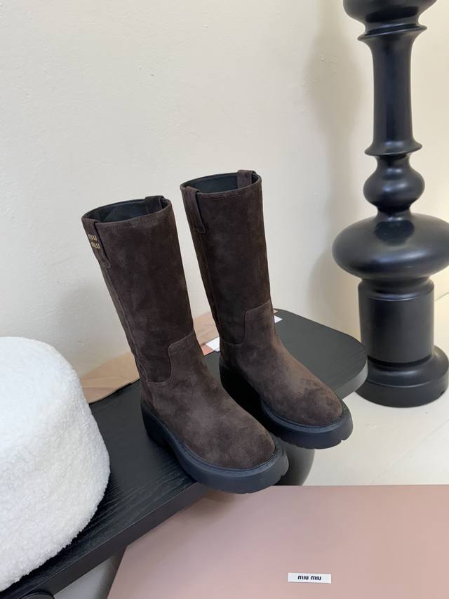 Miu Miu's double-eared, thick-soled, straight-leg boots are perfect for winter,