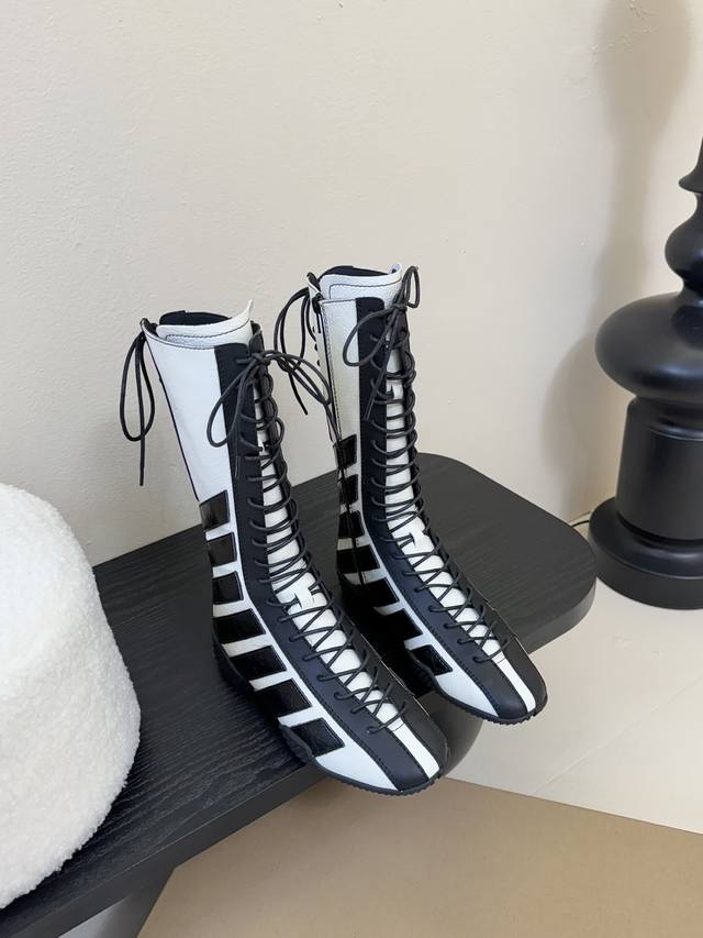 Miist* Boxing Boots Who knows? Miista boots play with the checkerboard pattern t