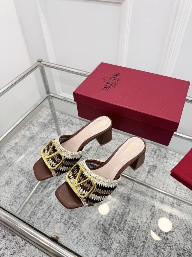 Valentino. Valentino's latest collection features hand-woven details with a stri