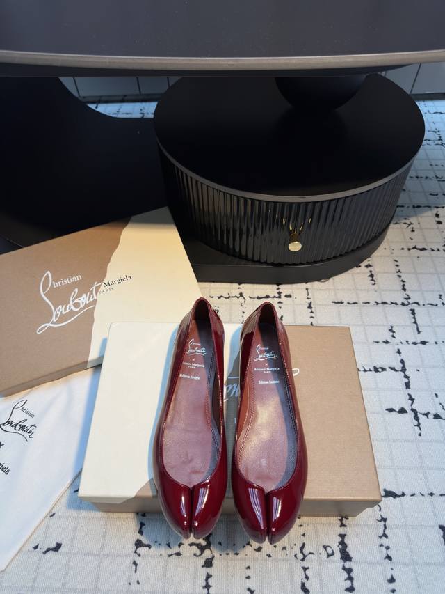 Cl x Maison Margiel* 25Ss split-toe flats. Maison Margiela and Christian Loubout