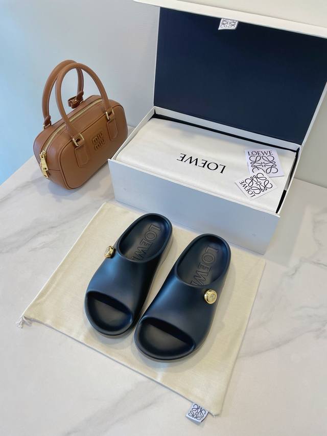 Loewe Foam Pebble Sandals. Lightweight foam rubber sandals with a shiny metallic