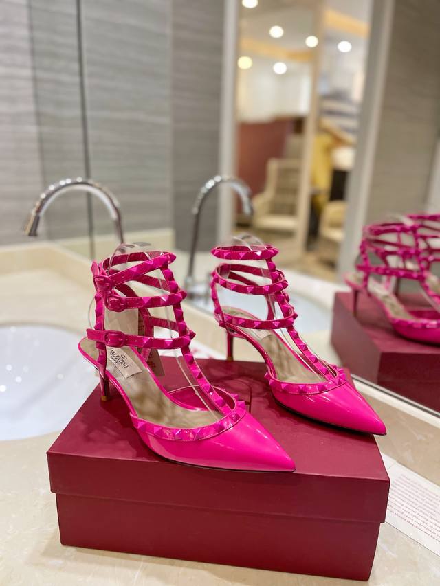 The latest color of Valentino's tonal rivet-studded lace-up high heels, a natio