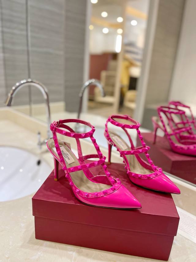 The latest color of Valentino's tonal rivet-studded lace-up high heels has been