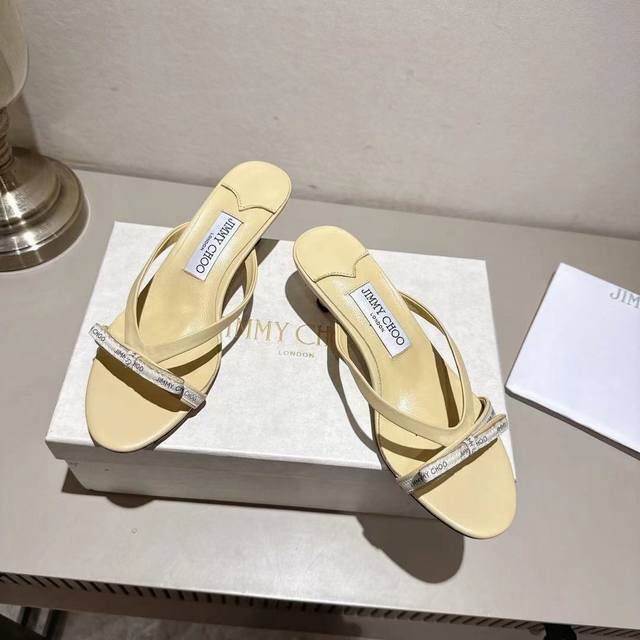 Jimmychoo's 2025 cream webbing mules are here, paired with a logo bow, for a gen