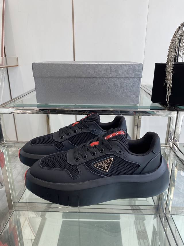 Prada's white sneakers, a classic upgrade from the Prada couple's collection, ma