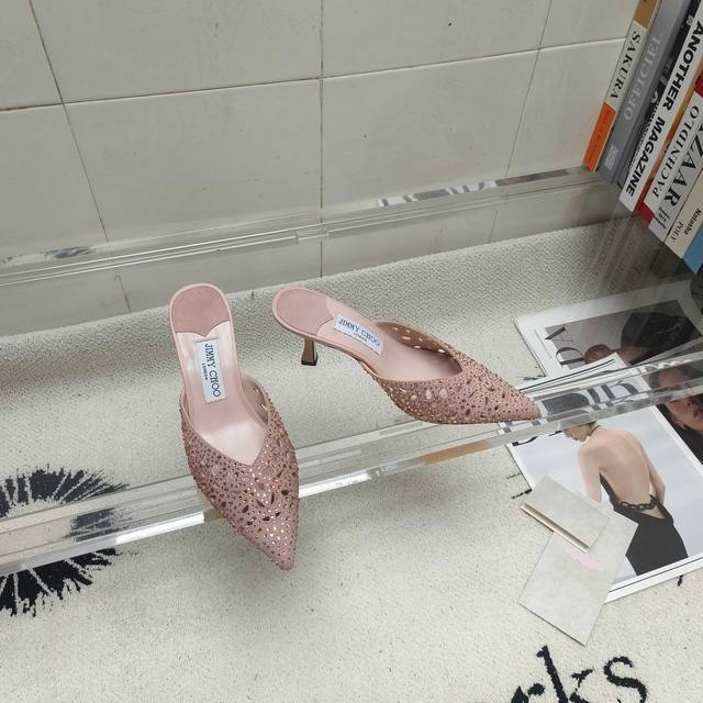 Jimmy Choo's classic pointed-toe, rhinestone-embellished slippers are truly capt