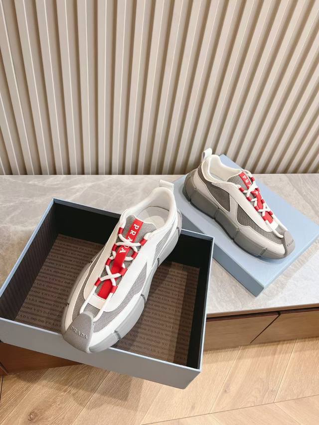 Prada men's lace-up leather sneakers, featuring a cowhide upper with breathable