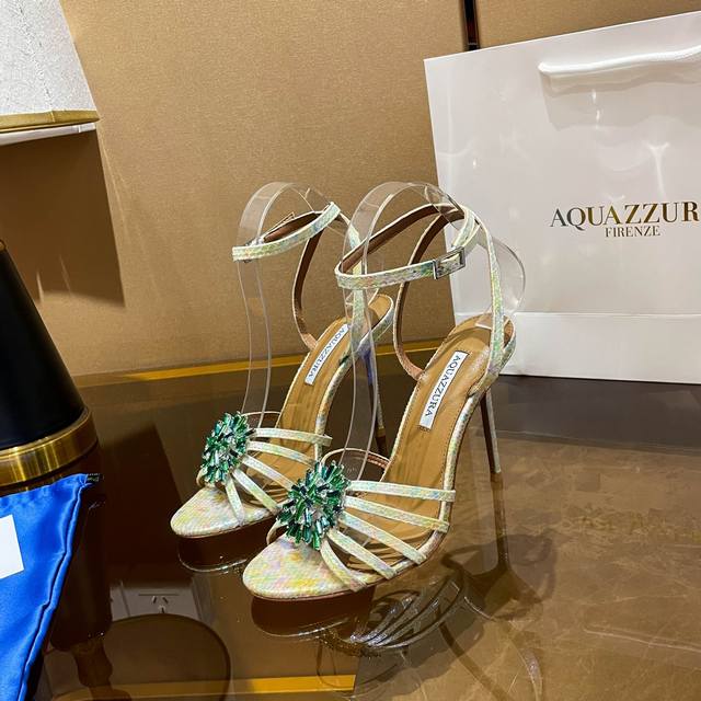 Aquazzura's new sandals, DDD, feature a vibrant snake-print sheepskin design. Th