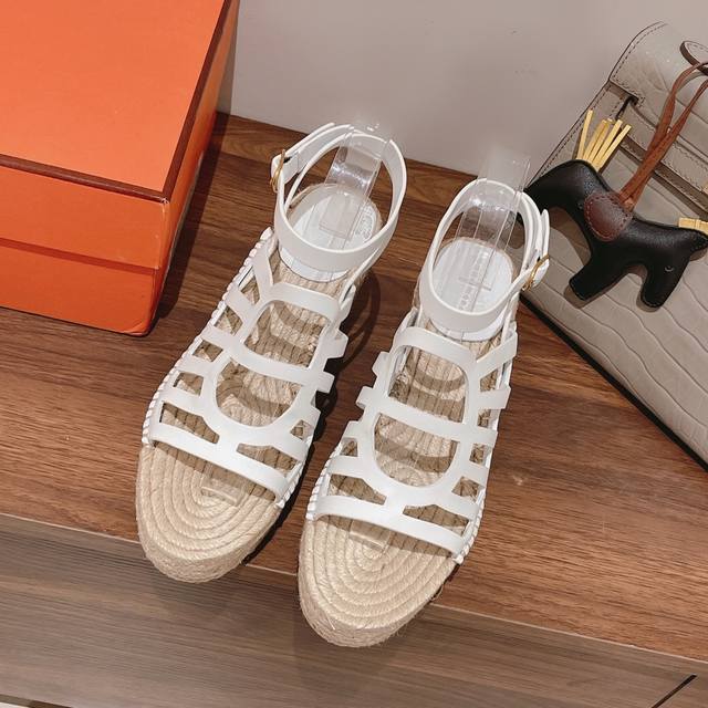 Herme* New early spring straw sandals from Herme. Handcrafted stitch by stitch,