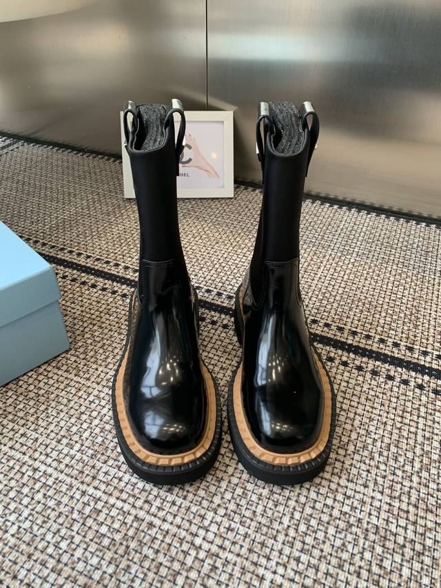 Prada's classic triangle-shaped ankle boots are the main collection for this fal