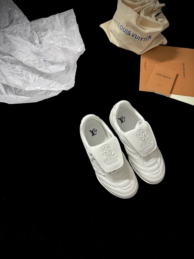 Lv Foottprint Soccer New This retro sneaker features a suede texture and a class