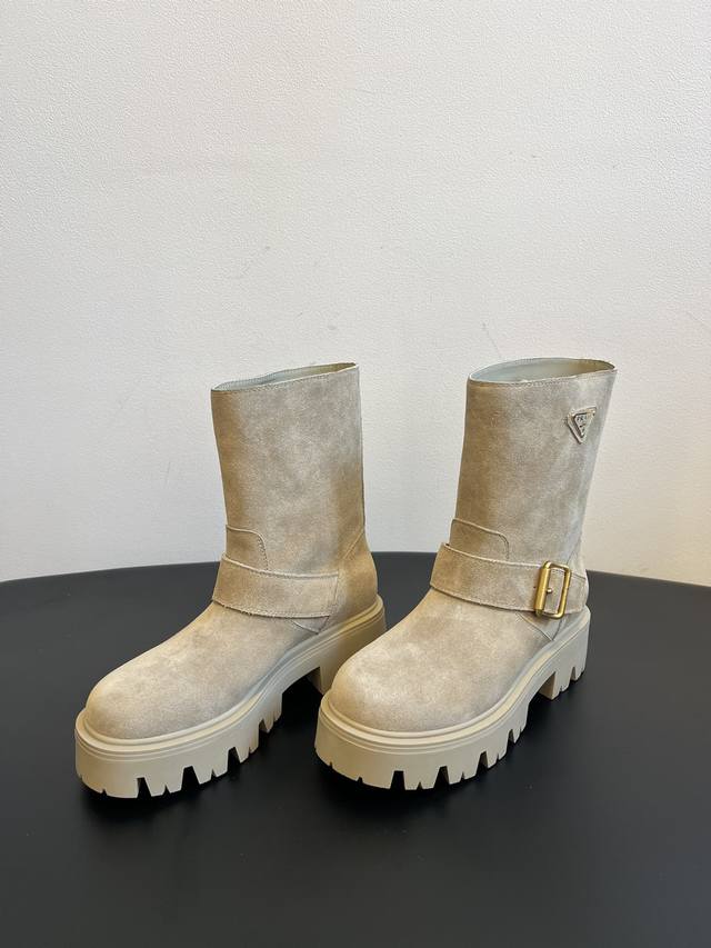 Prad* 25Ss Prada classic triangle logo slip-on boots (DDD). A must-have for wome
