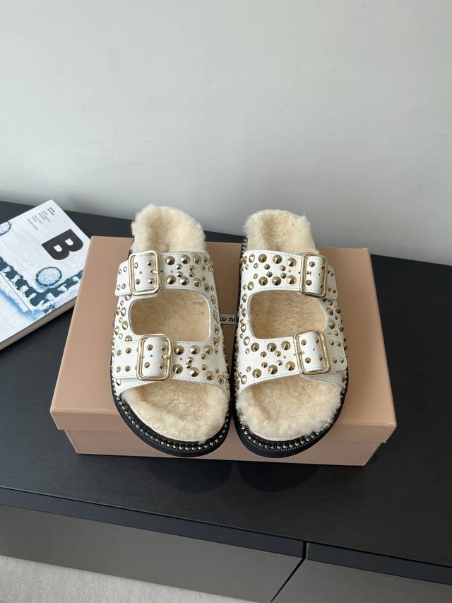 Miumiu's new thick-soled riveted wool slippers are now available. These flat, so