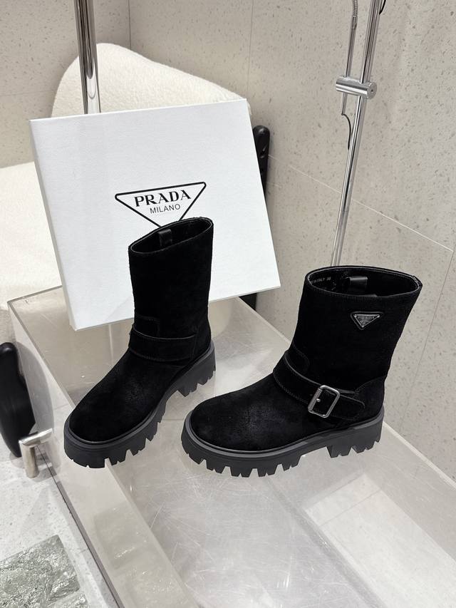 Premium-quality cowhide and suede DDD. Prada's latest mid-calf boots with triang