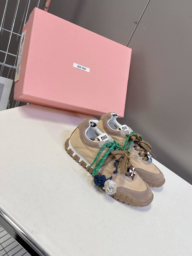 Accessorized with Miumiu Spring/Summer runway-inspired biscuit shoes, Forrest G